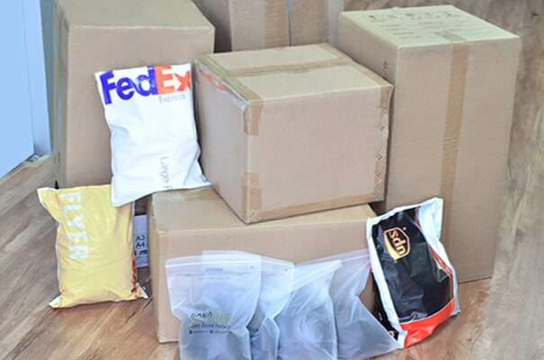 big boxes of packaged hair systems