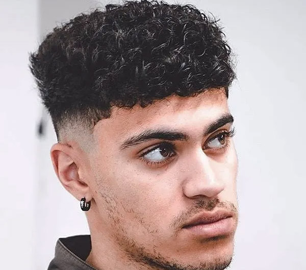 17.Natural Curly Hair with a Clean Drop Fade