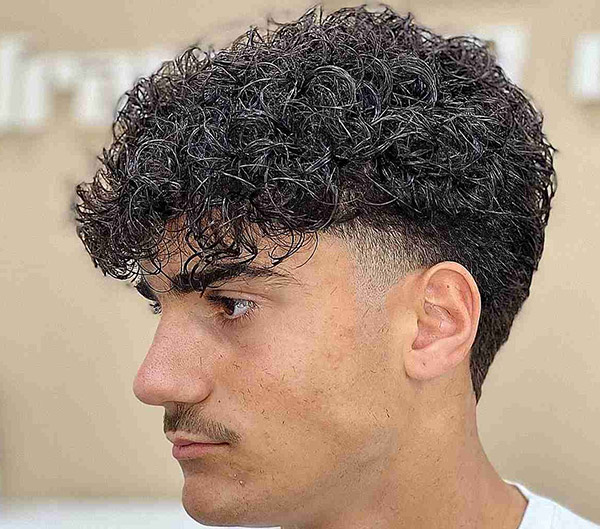 20.Low-Fade Cut with Messy Texture on Top