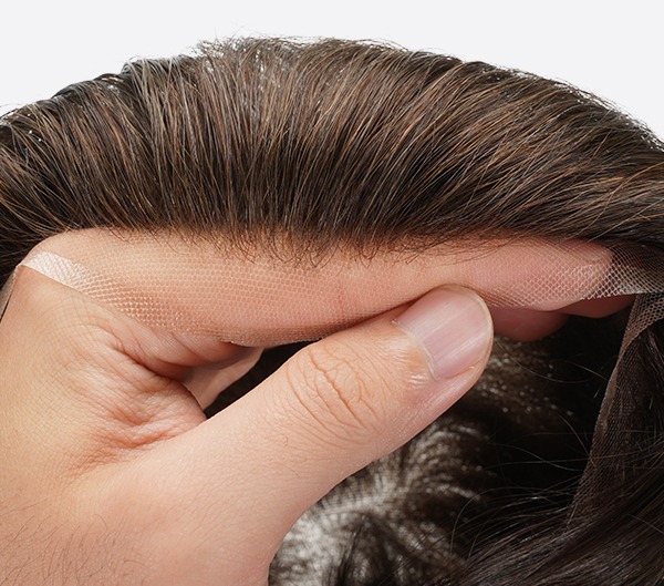 Close-up of Bono Hair BH2 lace hair system showing an invisible hairline for a natural look.