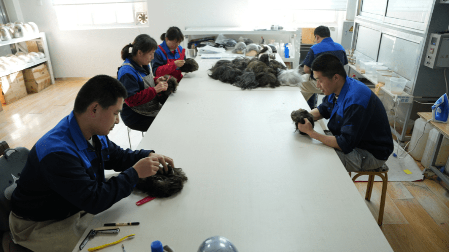 inspectors doing the final QC before the hair systems are packaged