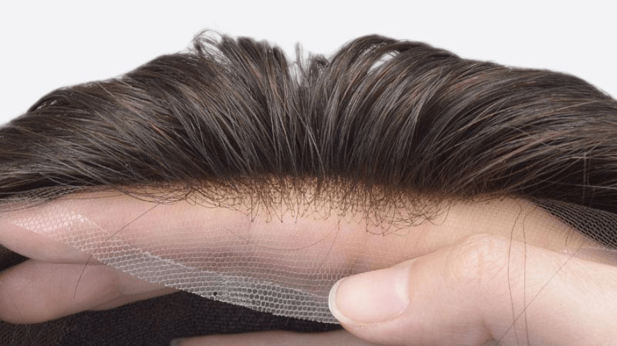 close up of men's toupee hairline with unbleached knots